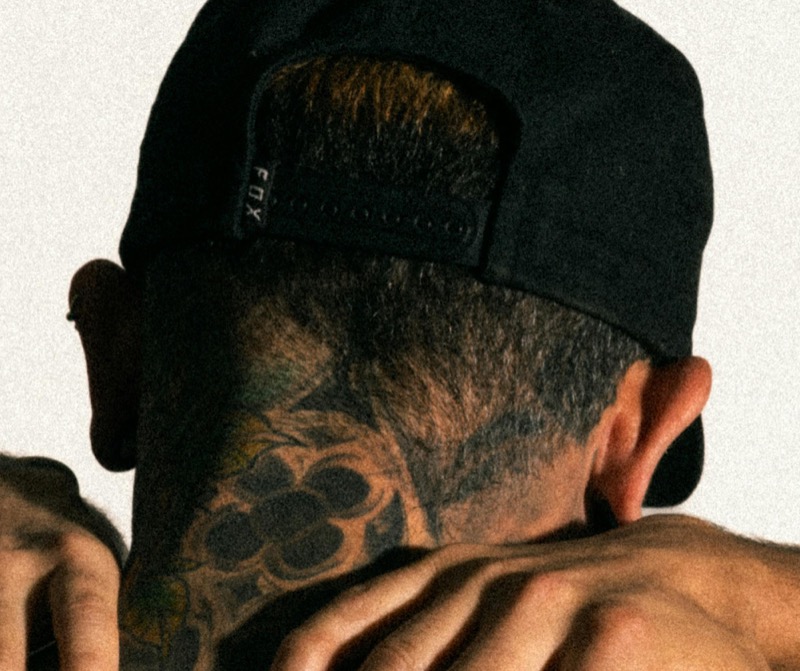 Negative space neck tattoo