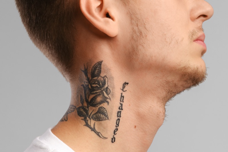 Rose side neck tattoo
