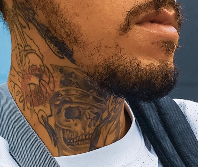 Skull front neck tattoo