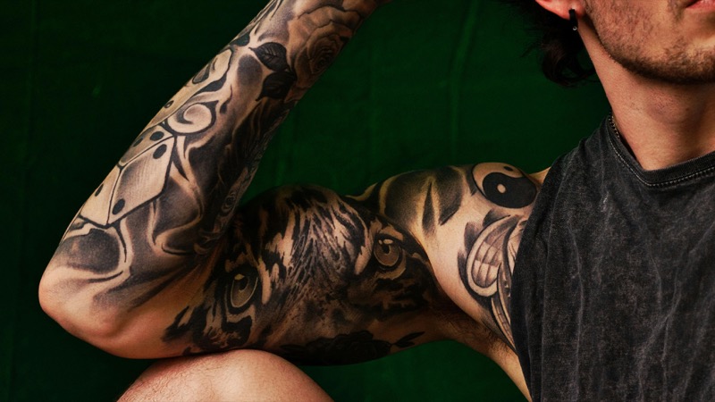 Black grey realism shoulder to sleeve tattoo