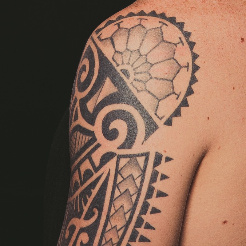Geometric blackwork shoulder tattoo