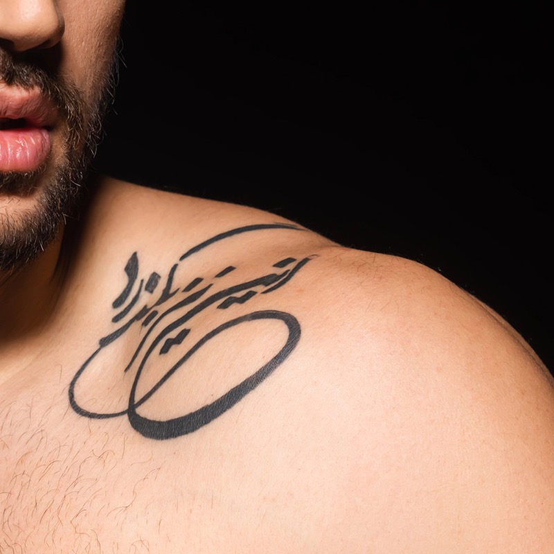 Script shoulder tattoo