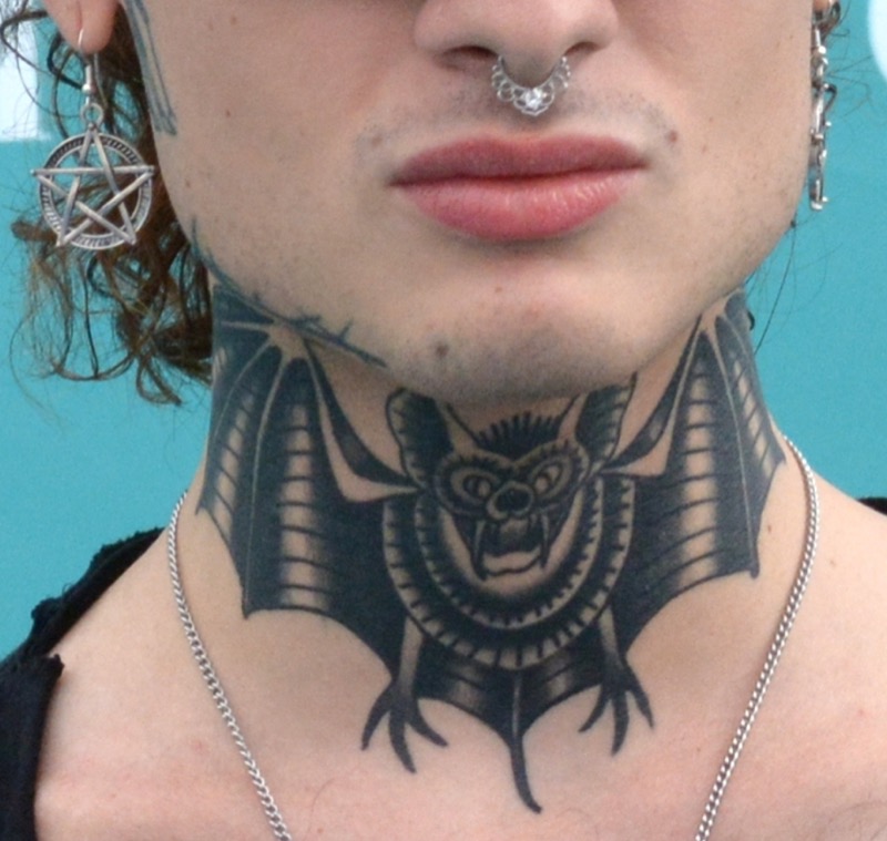 Rosa Chemical's bat neck tattoo