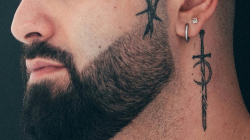 Dagger crescent side of neck tattoo