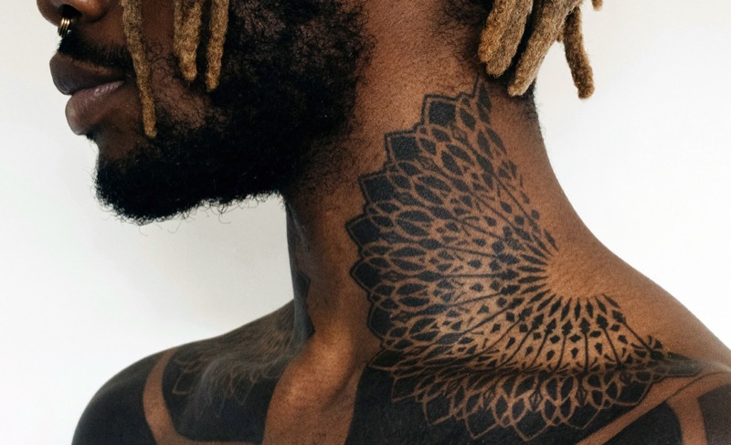 Mandala neck tattoo black man