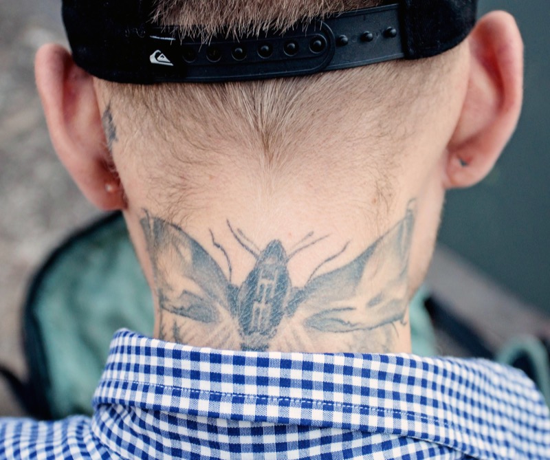 Moth back of neck tattoo