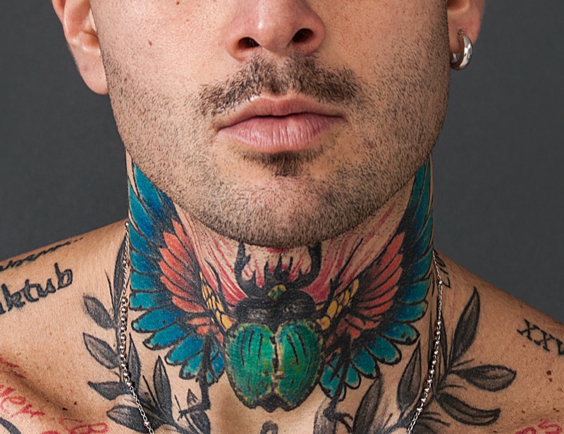 Scarab neck tattoo
