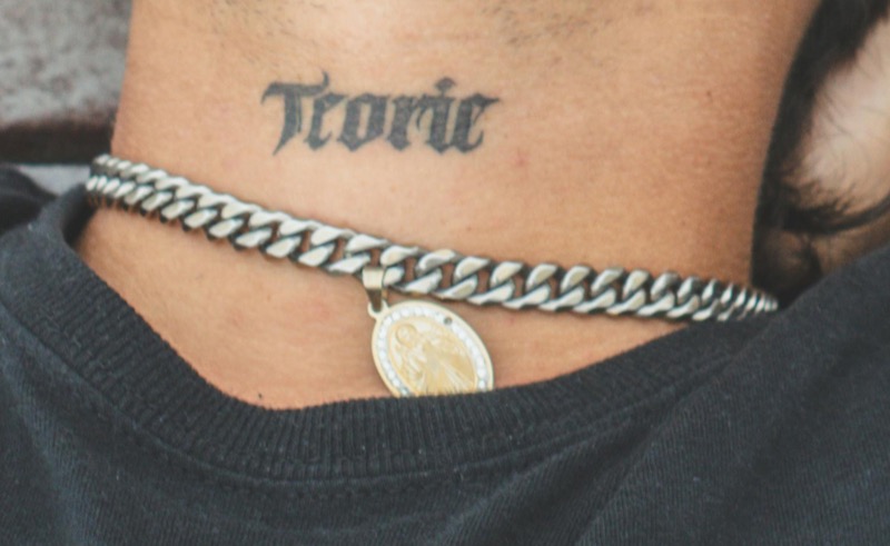 Small neck tattoo word