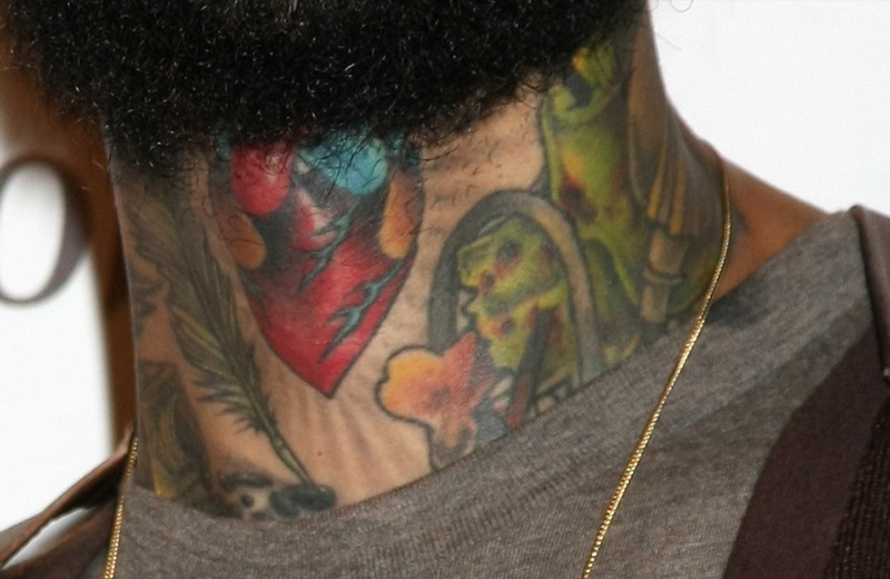 Traditional neck tattoo on Travie McCoy