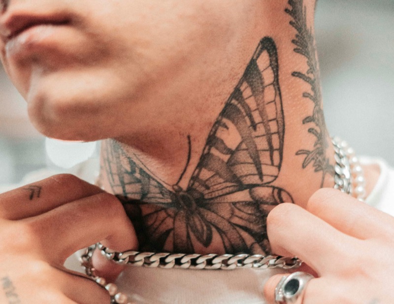 Butterfly neck tattoo