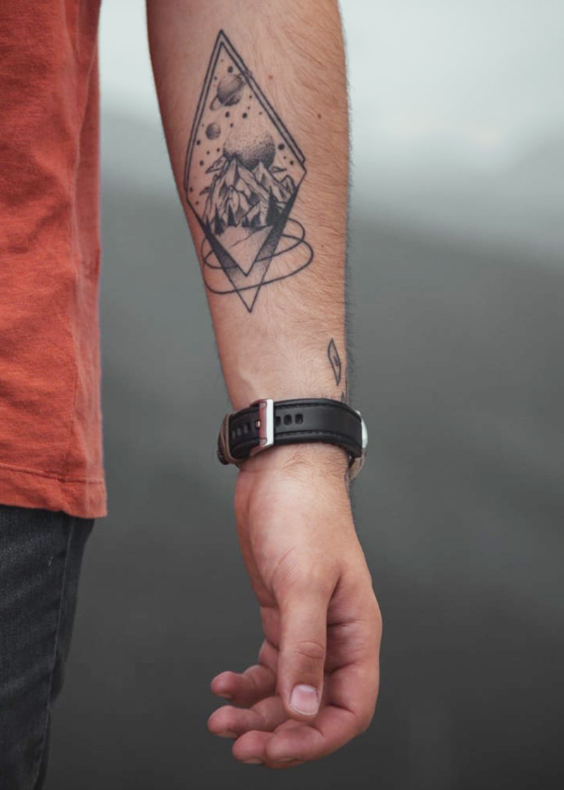 Celestial forearm tattoo