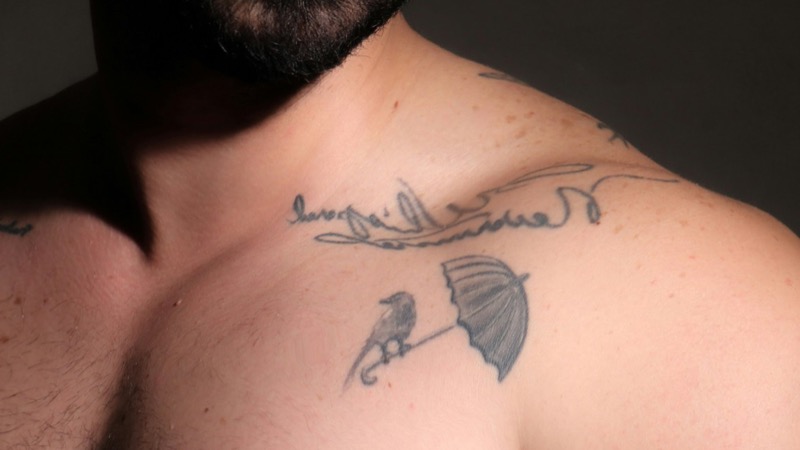 collarbone fine line script chest tattoo men