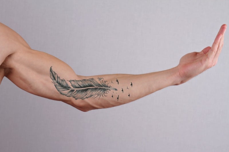 Feather forearm tattoo