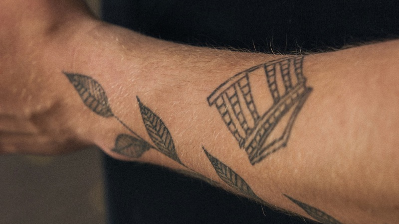 Fine line forearm tattoo