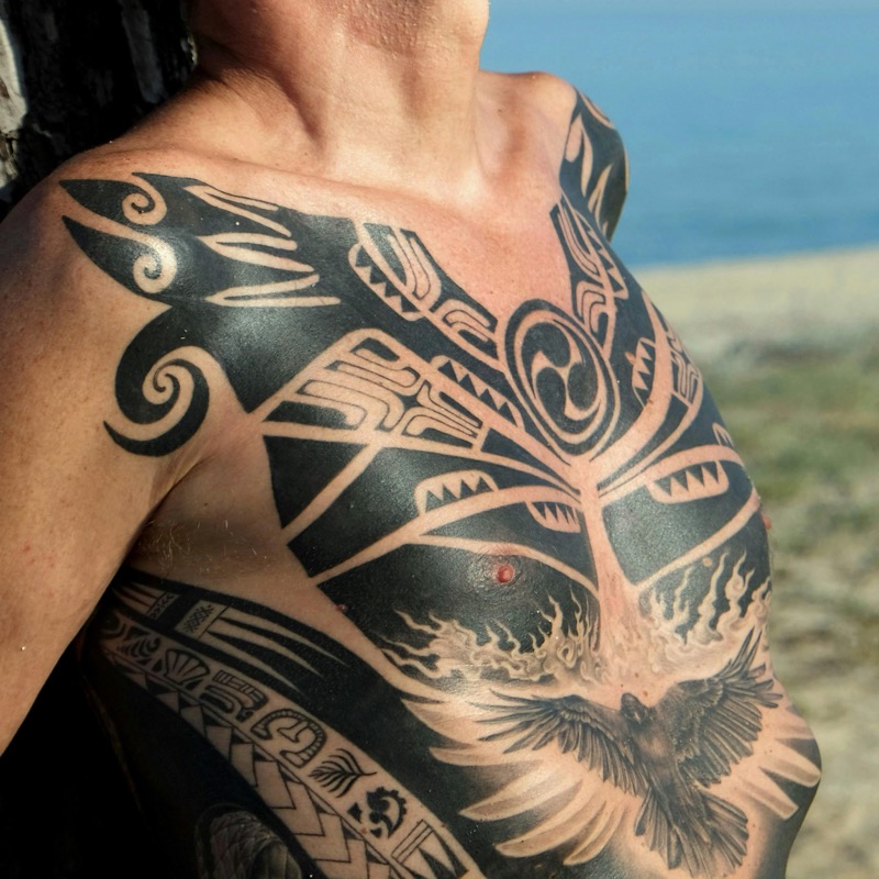 full chest polynesian tribal blackwork tattoo men