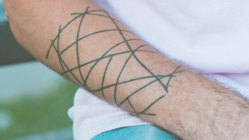 Geometric forearm tattoo