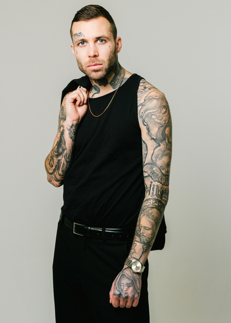 Man with forearm tattoos portrait