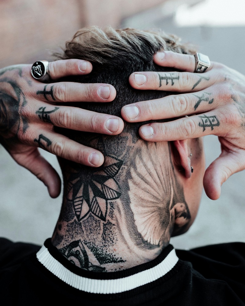 Neck and hand tattoos