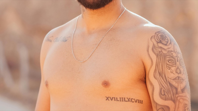 roman numerals chest tattoo men