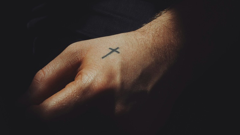 small cross hand tattoo men
