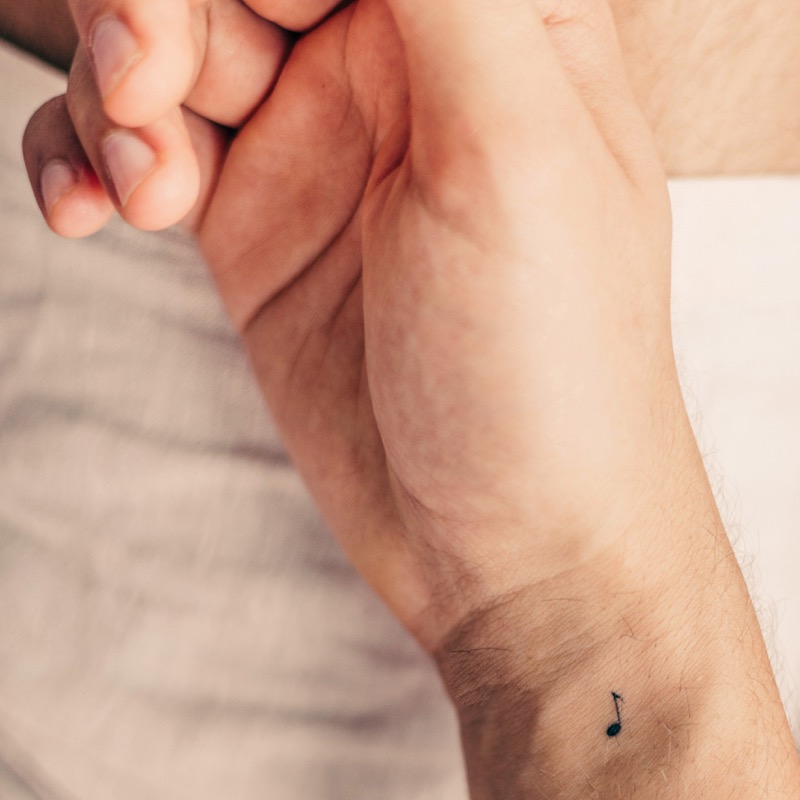 small music note wrist tattoo men