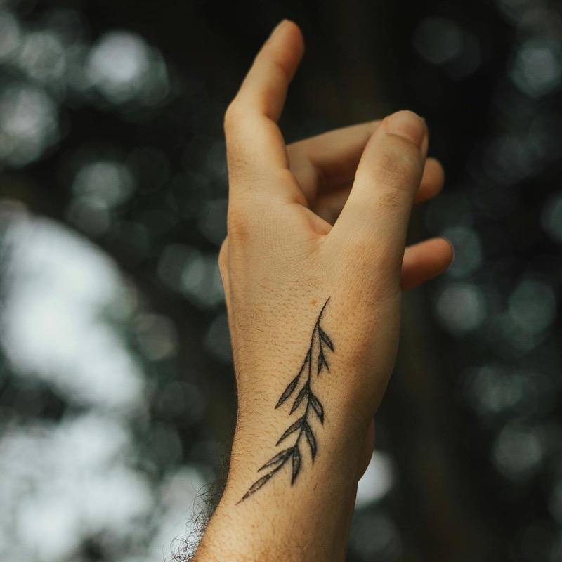 small olive branch hand tattoo men