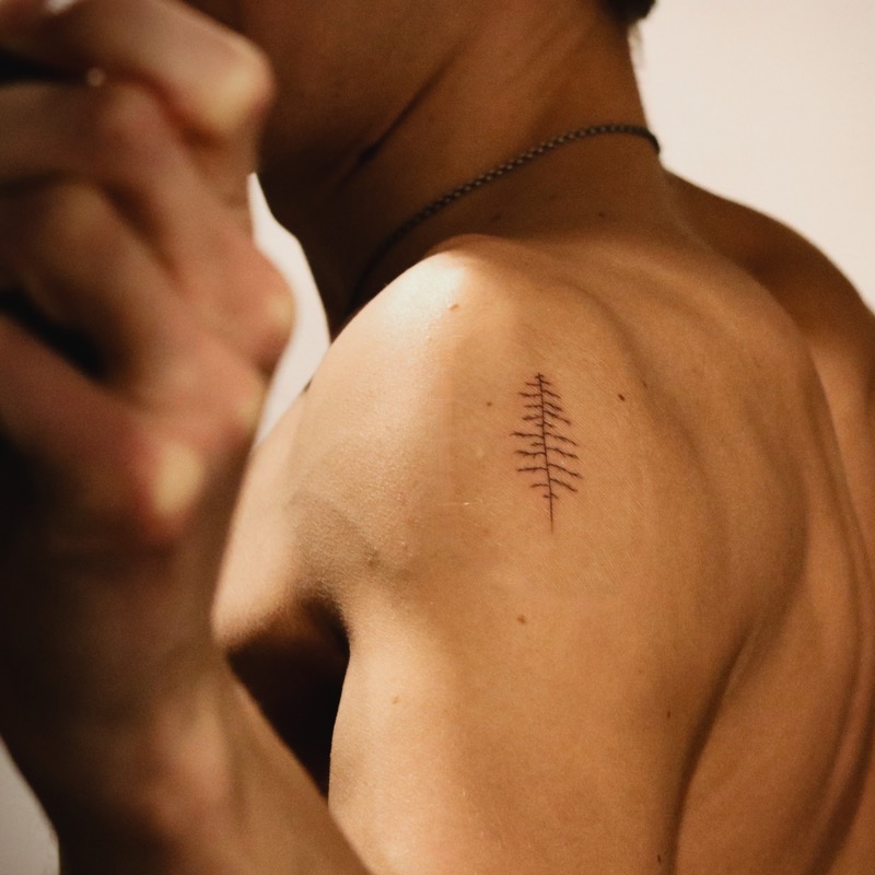 small pine tree shoulder tattoo men