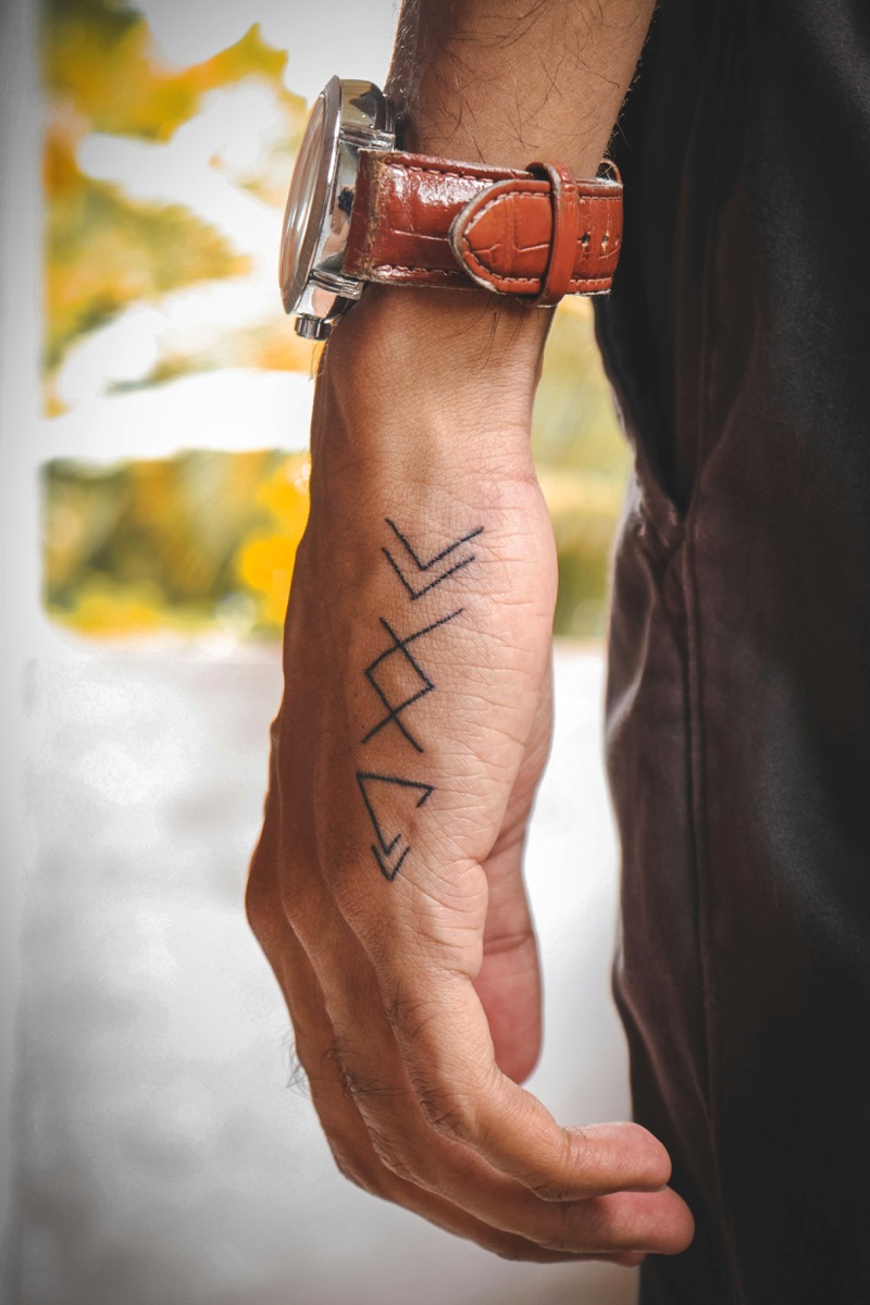 small rune hand tattoo men