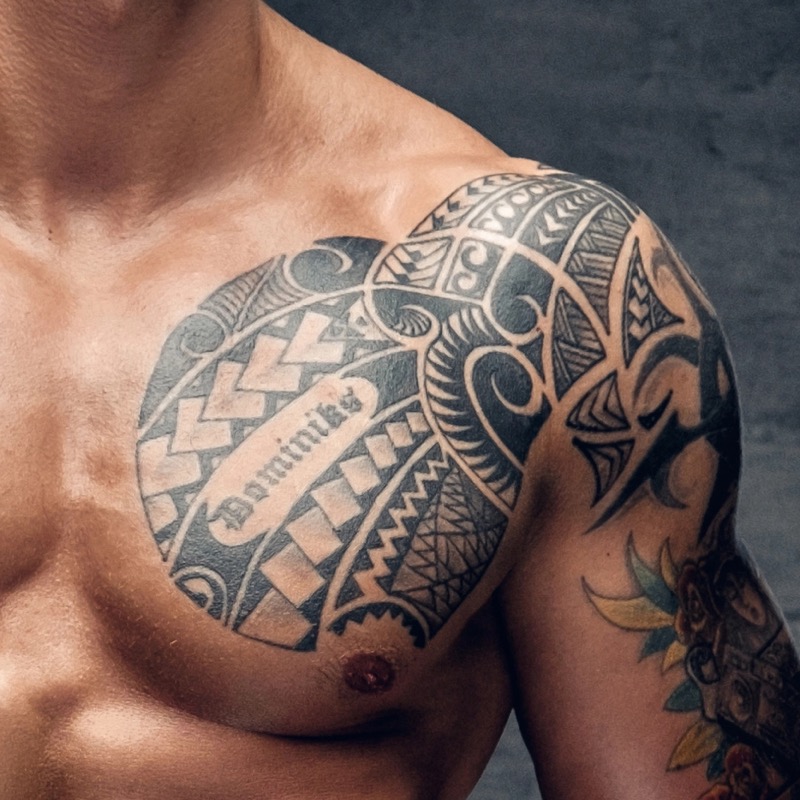 Polynesian-inspired tribal chest tattoo